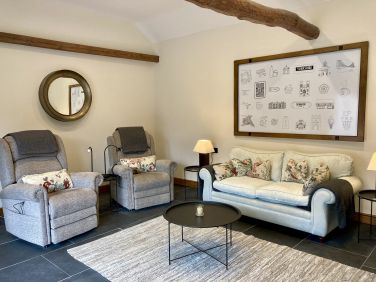 Sitting room at The Old Stables with two rise and recline chairs for ultimate comfort