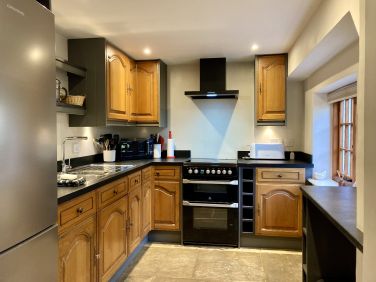 Ruth&rsquo;s cottage kitchen which leads to the dining area