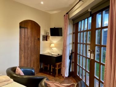 The Hideaway dining area next to the arched kitchen door