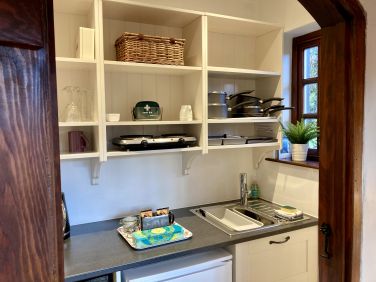 Hideaway kitchen, leading to the wet room.