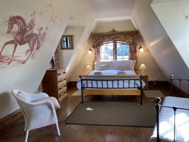 Bakers cottage characterful master room. Feature bathroom down the hall with slipper bath & shower.