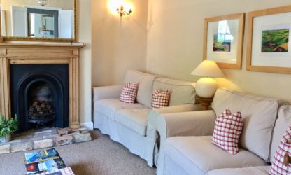Sitting room to Horseshoe Cottage with seating for 6 people