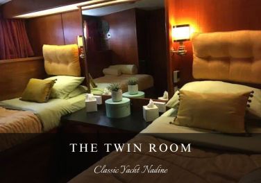 The Twin Room, with Books and Views of the Marina