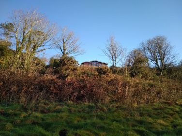 The cabin seem from the valley below