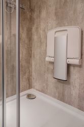 En suite disabled seat folded away