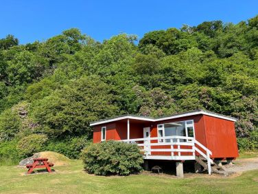 Lochead Chalet with blue skies above