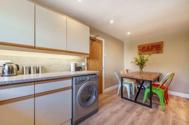 Orrest Head Cottage kitchen with dining area.