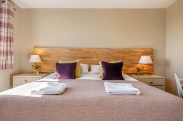 Orrest Head Cottage bedroom 1 super-king-size bed.