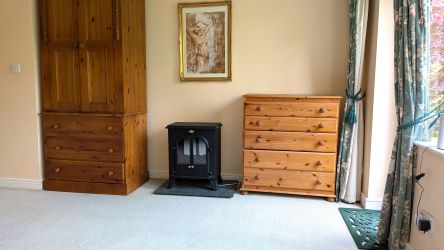 Double bedroom downstairs with views of  private gardens