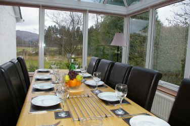 Dining room with the views of the garden and the hills.