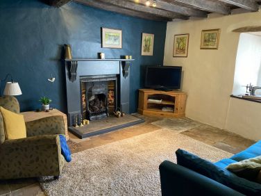 Cosy snug with further seating and TV.