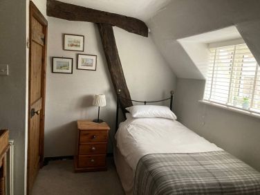 Exposed cruck frame in twin room.