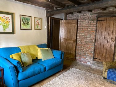 The snug is accessed from the middle room and the kitchen.