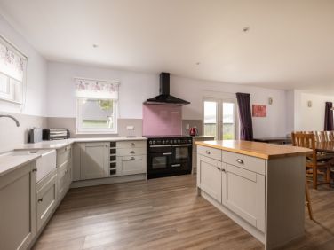 Huge kitchen area with breakfast bar at The Capercaillie at airhouses