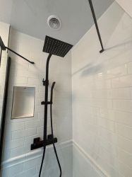 Master ensuite shower cubicle with rain shower fixed head and handheld shower.