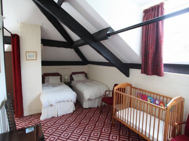 Attic suite with king size bedroom, 4 single beds and bathroom