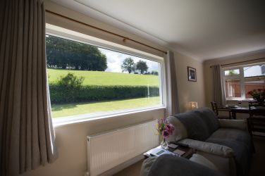 Relax and unwind enjoying beautiful countryside views from the comfy sofas