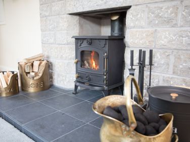 Cosy central heating at Wall & Lakes cottage, Brampton, Cumbria with optional, multifuel stove.
