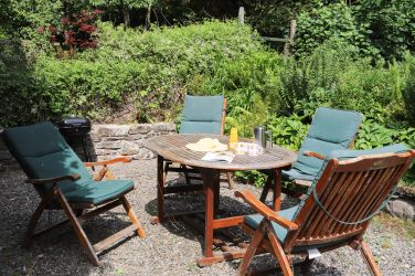 Seating terrace next to the cottage has a little barbecue as well