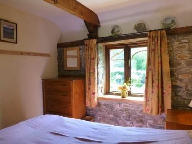 Single bedroom looks out to the garden