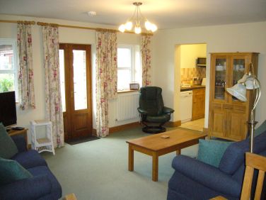 Living room showing doors to courtyard