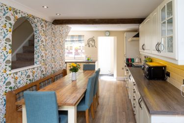 Spacious fully fitted kitchen with farmhouse table