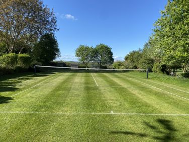 Grass tennis court May to early September.