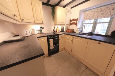 The well equipped kitchen has a dishwasher.