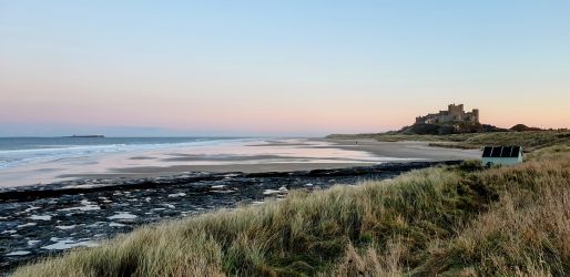 Bamburgh Castle and Beach looking towards the Farne Islands