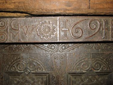 Date carved on traditional cumbrian built in court cupboard in the sitting room