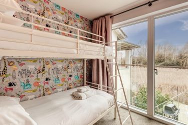 First floor bunk bedroom with cot