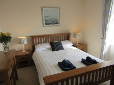 King sized bedroom with sea view