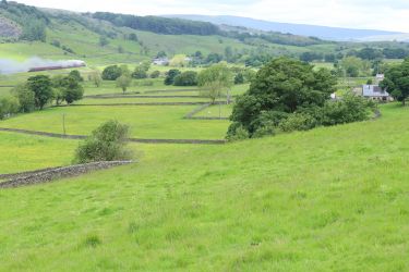 Steam trains pass by most weeks on The Settle to Carlisle Railway. Meadow View Barn is on the right.