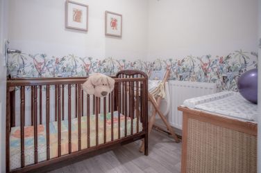 Enclosed nursery for the young ones with changing mat and high chair