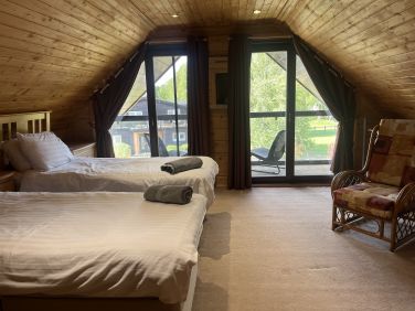 Upstairs twin bedroom with balcony