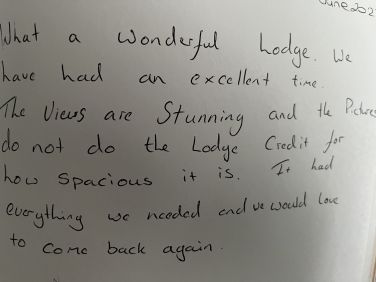 Handwritten guest review: &ldquo;What a wonderful lodge. We have had an excellent time"