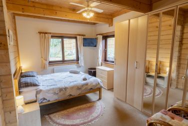 Main downstairs bedroom with king-size bed and access to main bathroom