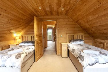 Upstairs twin bedroom with balcony