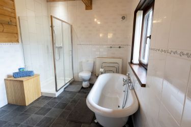 Main downstairs bathroom with shower and claw-foot bath