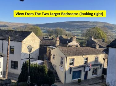 The slightly elevated position offers stunning views across Hawes towards The Buttertubs Pass