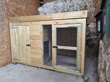 The lockable dog kennel, accessed from the drive. Dogs can be left unattended in the kennel.