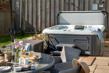 The hot tub on the patio.