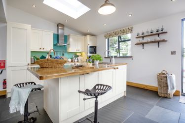The open plan kitchen area with central island.