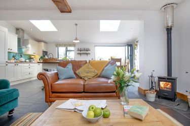 The living open plan living area with Log burner.