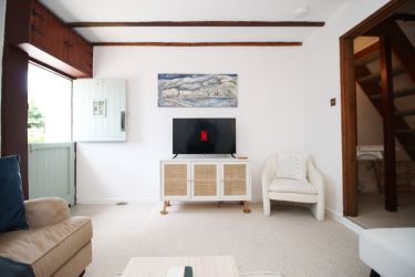 View from log burner with smart tv