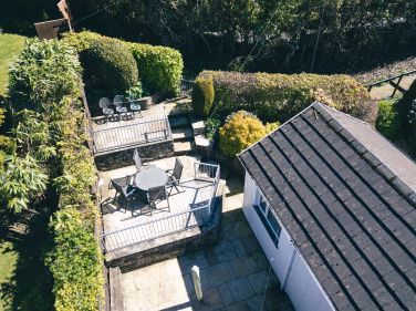 Tiered sheltered outdoor space at the rear.  Drone photo, this space is not overlooked.
