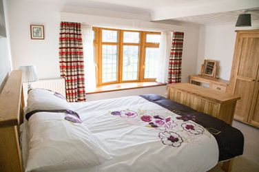 There is a lovely spacious bedroom with a double bed.