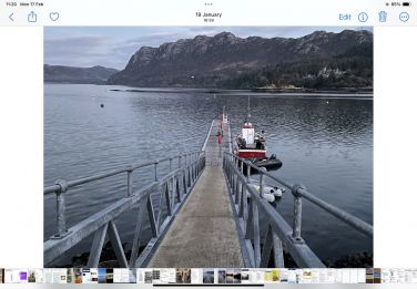 Fishing boat on pier pontoon