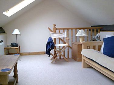 Loft area - additional sitting room with TV and sofabed