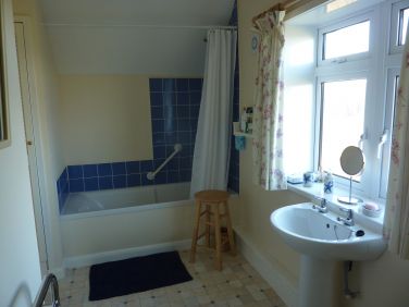 Bathroom.  Electric over-bath shower